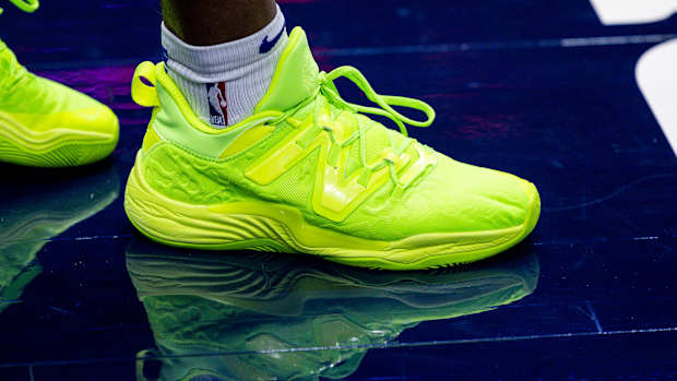 View of green New Balance shoes.